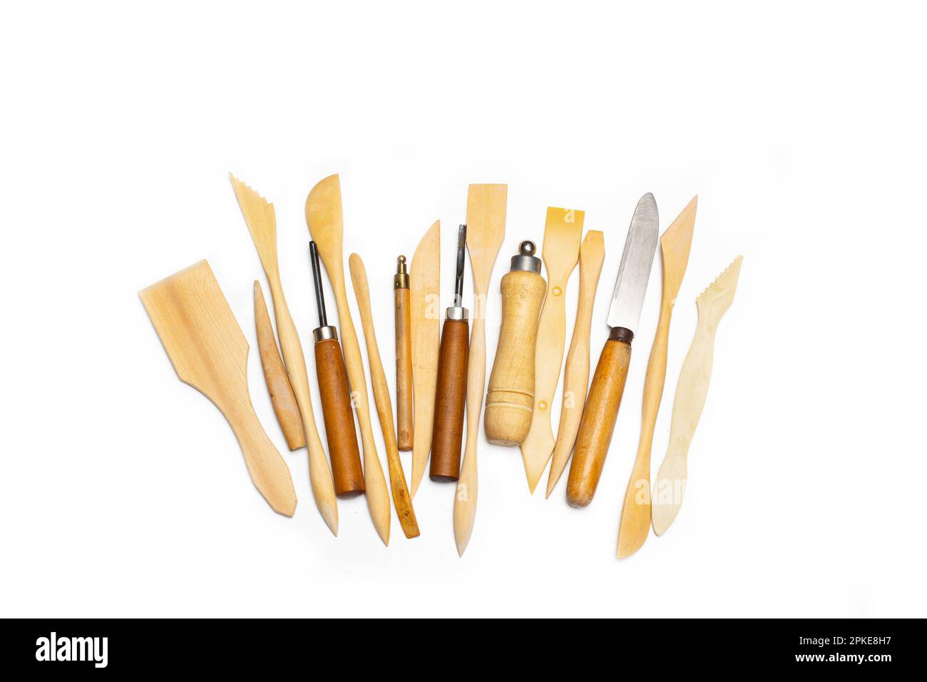 Wooden pottery spatulas, gouges and punches on a white background with ...