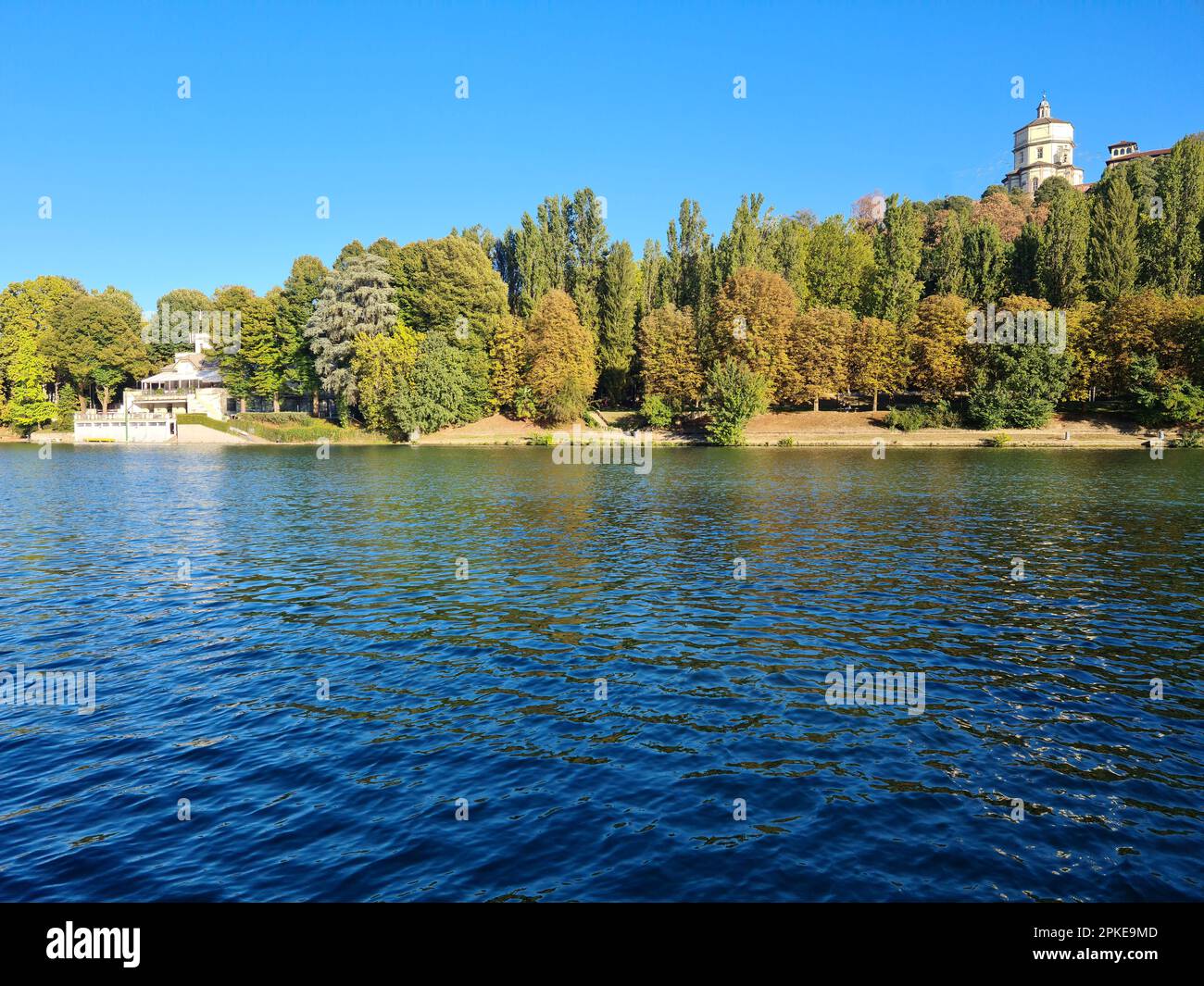 The river Po in Turin photographed by the Murazzi. On the river with the calm and blue waters, the Monte dei Capuccini rises on the Turin hill. Stock Photo