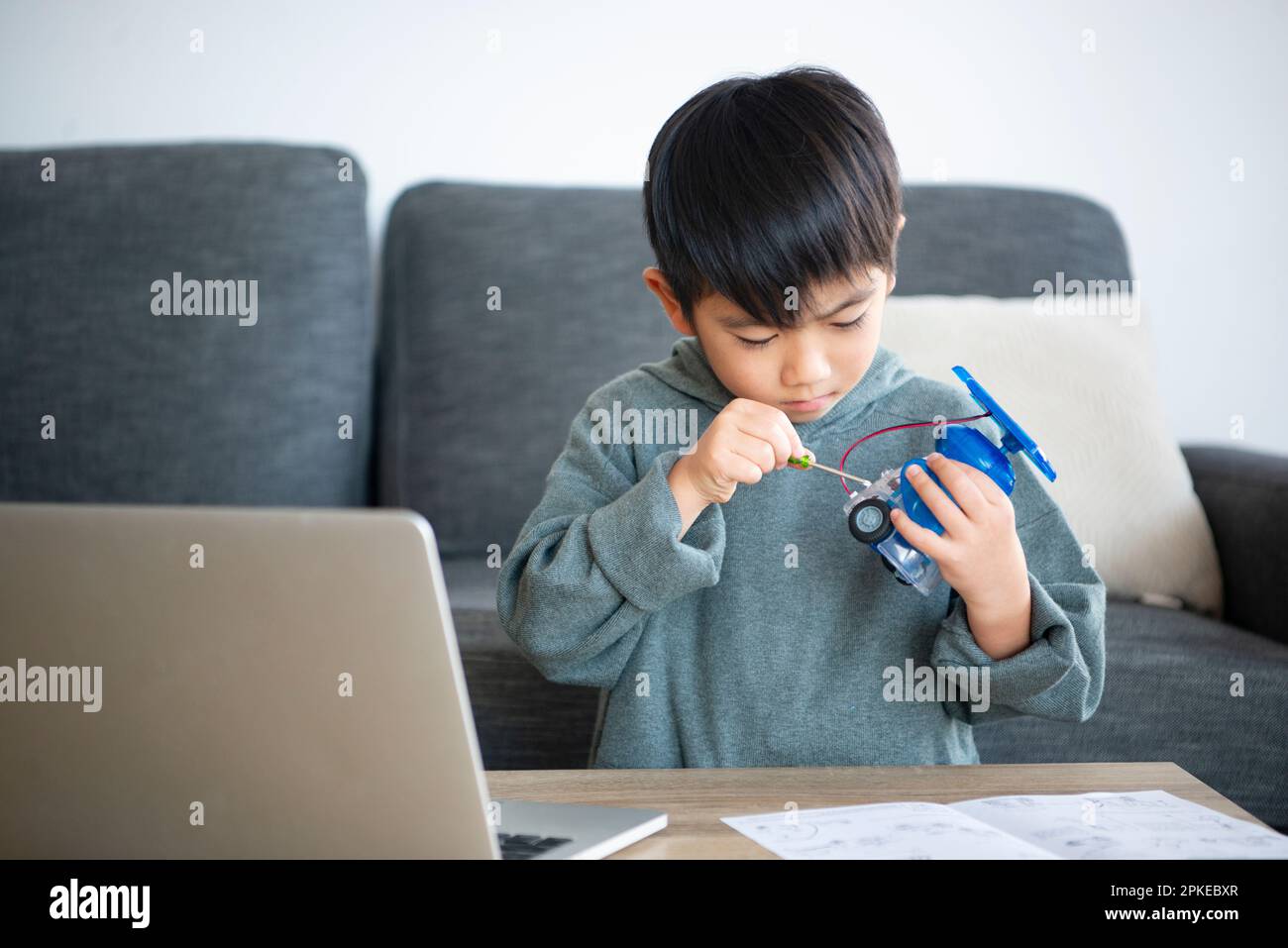 Boy making a robot Stock Photo