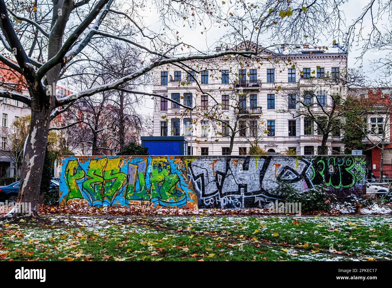 Graffiti covered wall & Historic listed 1891 apartment building,architect P. Fischer,Friedrich Wilhelm Platz 7,Tempelhof-Schöneberg,Berlin Stock Photo