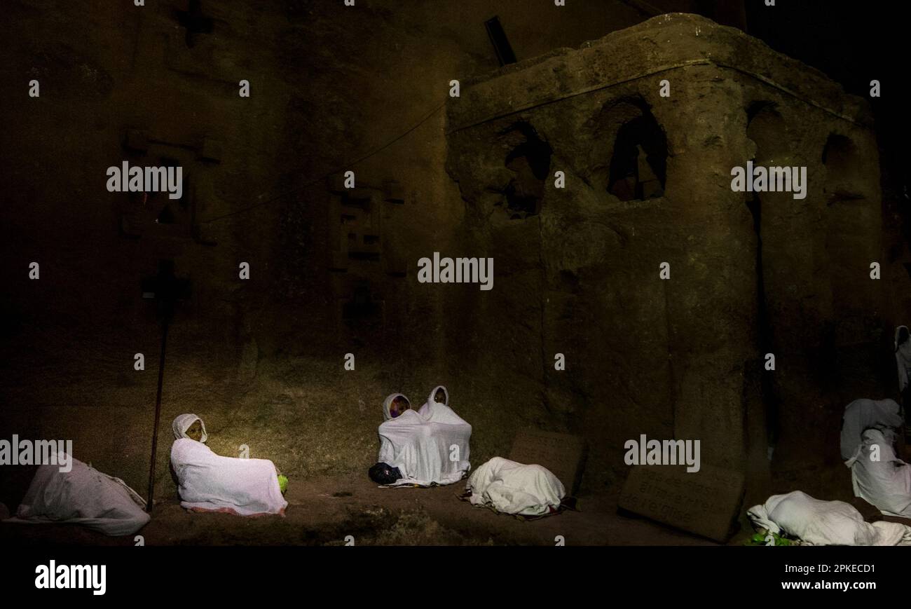 Pilgrims resting at the outside walls of Bete Medhane Alem in Lalibela during the holy Ethiopian Orthodox Easter celebration of Fasika Stock Photo