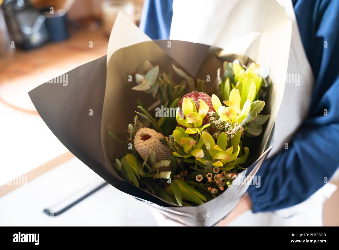Woman holding a bouquet of native Australian flowers Stock Photo