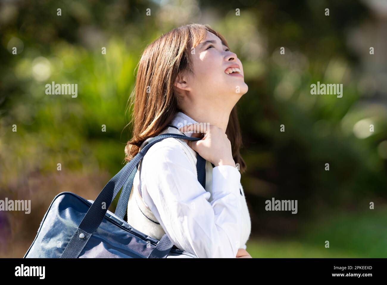 Schoolgirl in school uniform smiling in school uniform Stock Photo - Alamy