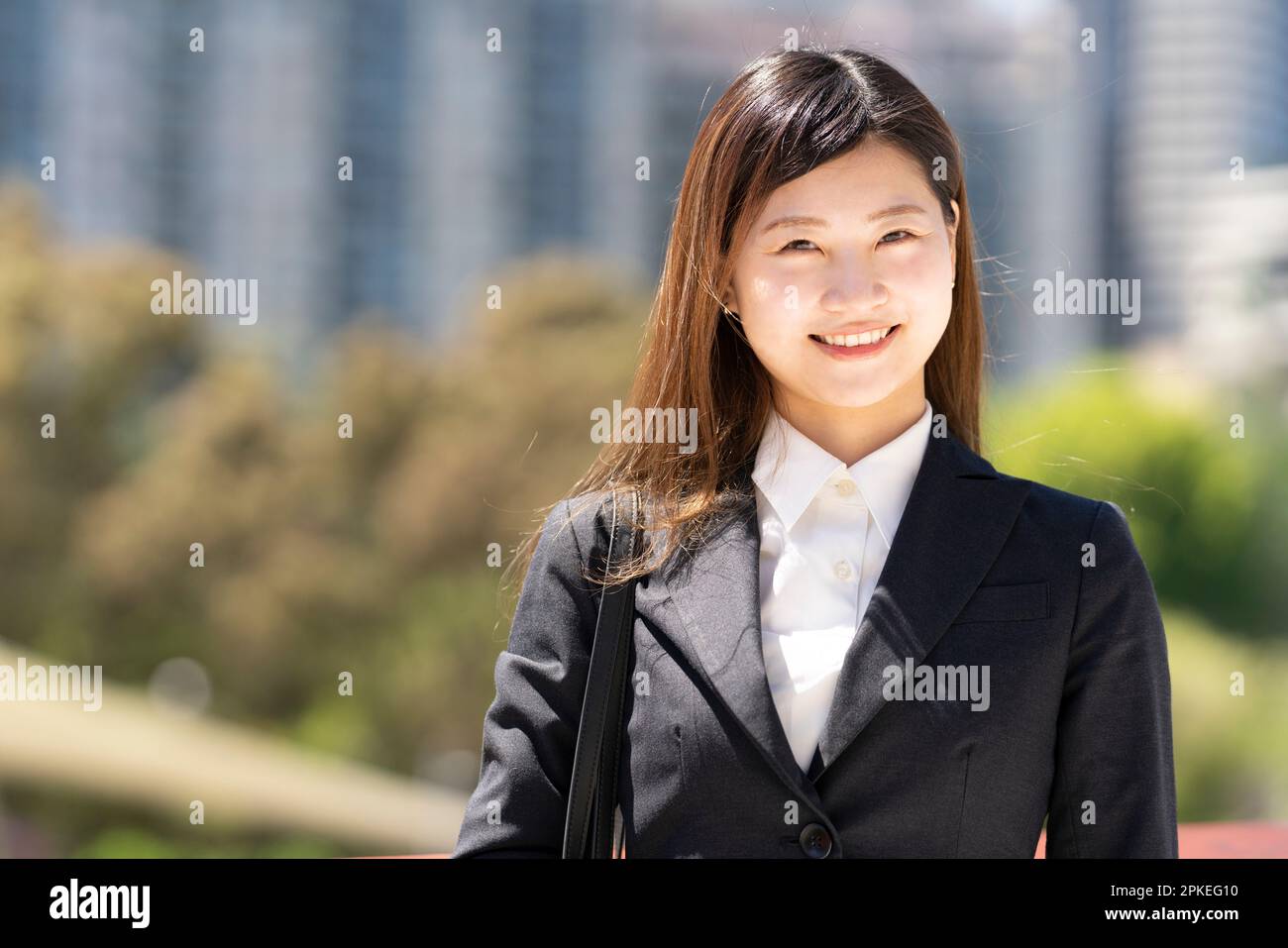 Smiling woman in a suit Stock Photo