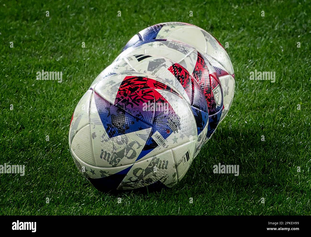 Soccer balls lined up on the pich Stock Photo - Alamy