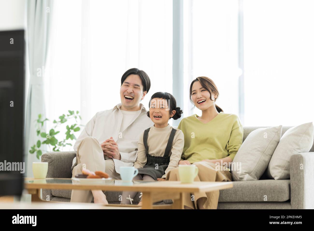 Family watching TV Stock Photo