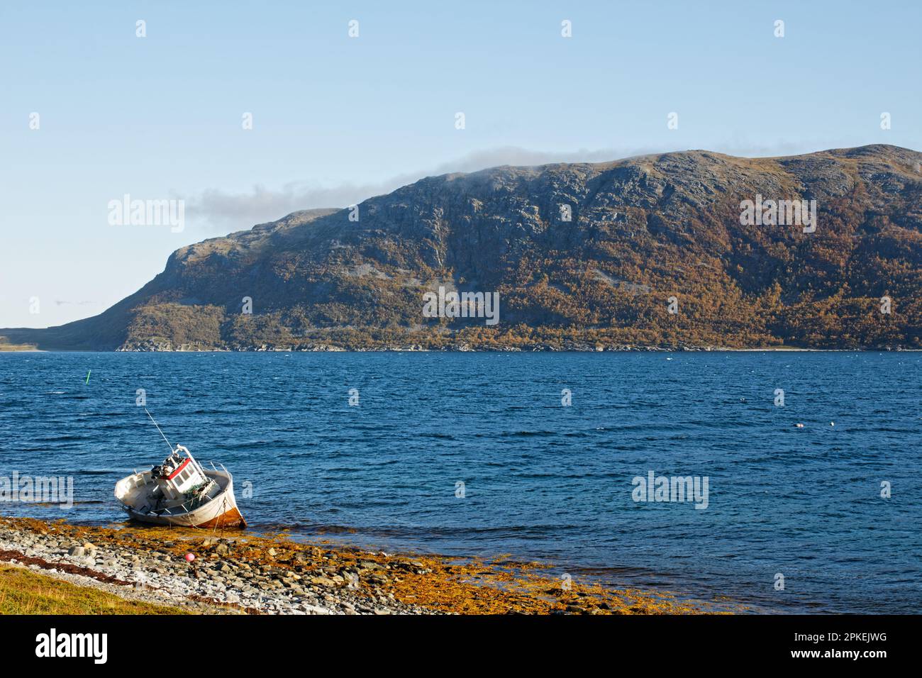 A small stranded boat, Troms og Finnmark County, Norway Stock Photo
