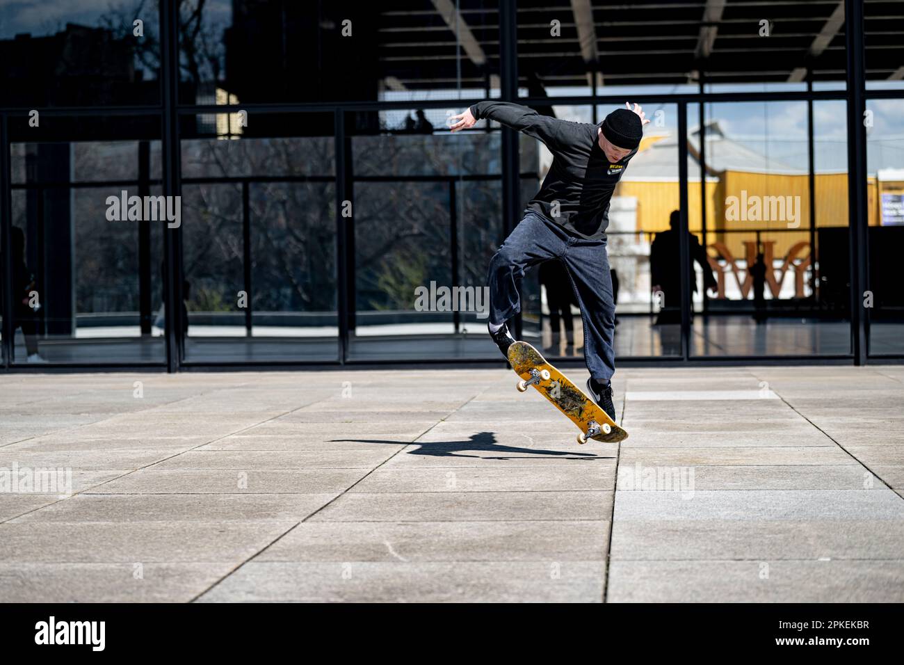 Berlin, Germany. 06th Apr, 2023. Skater Nils does a trick with his  skateboard in front of the Neue Nationalgalerie. Credit: Fabian  Sommer/dpa/Alamy Live News Stock Photo - Alamy