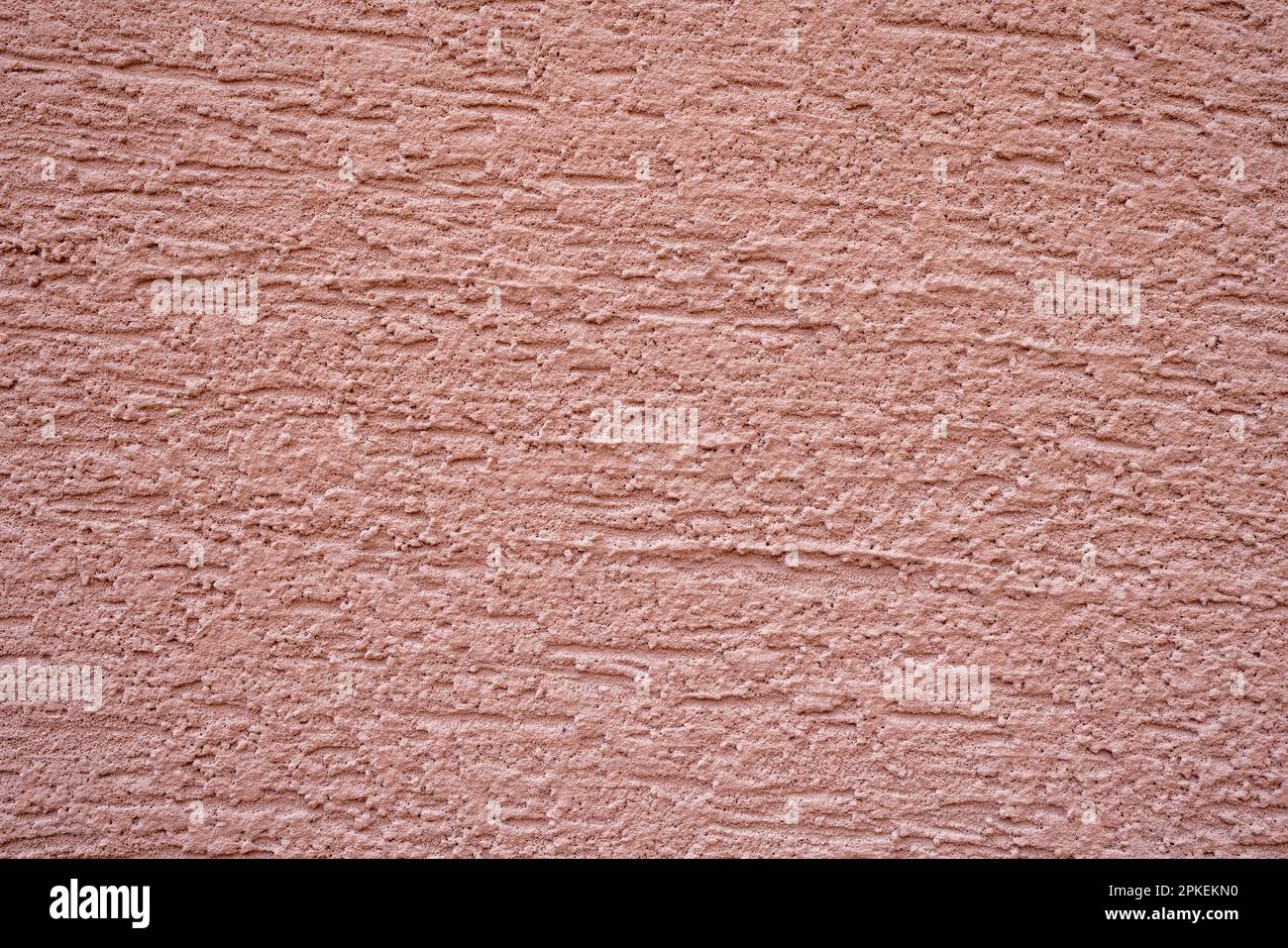 Pink coloured decorative plaster of external walls. Stock Photo