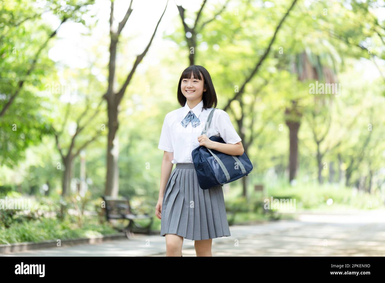 High school girl walking in the park Stock Photo