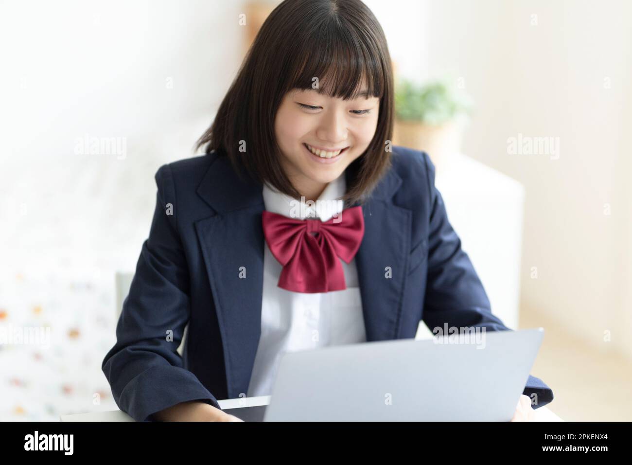 A high school student taking an online class Stock Photo - Alamy
