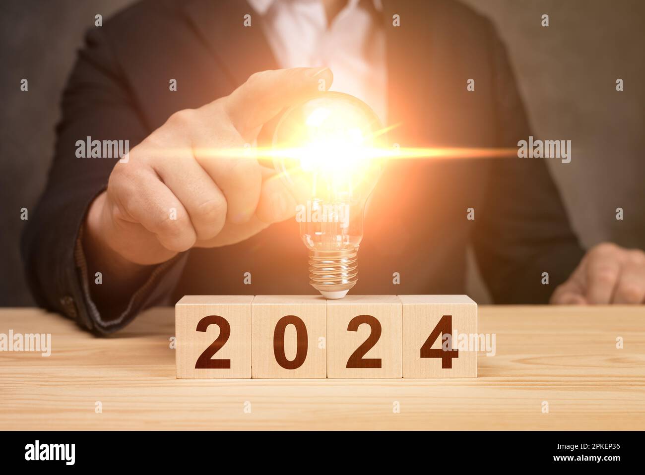2025 New Year Idea, Inspiration Concept. Businessman touching light