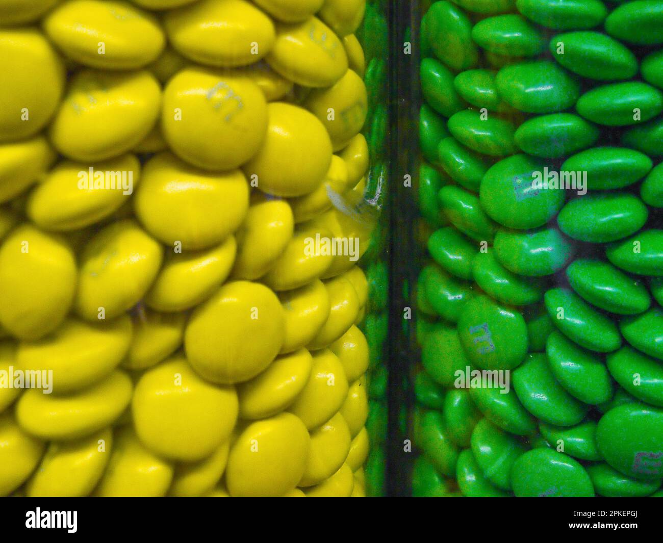 Yellow and green candy. M and M dispensers in candy store, Marlborough, MA Stock Photo Alamy