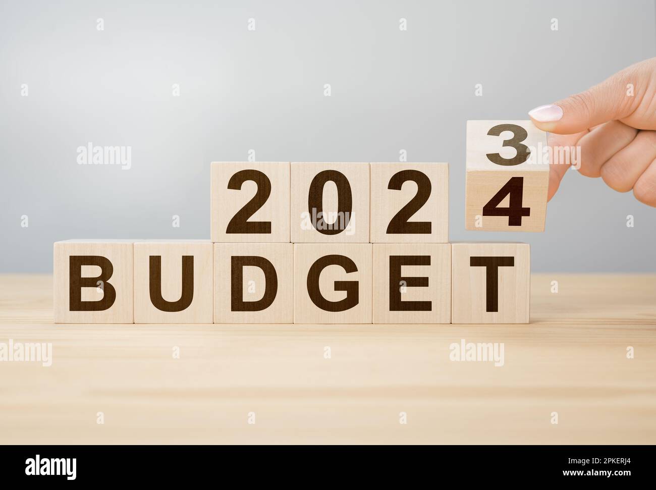 Business concept of planning 2025. Businessman flips wooden cube and