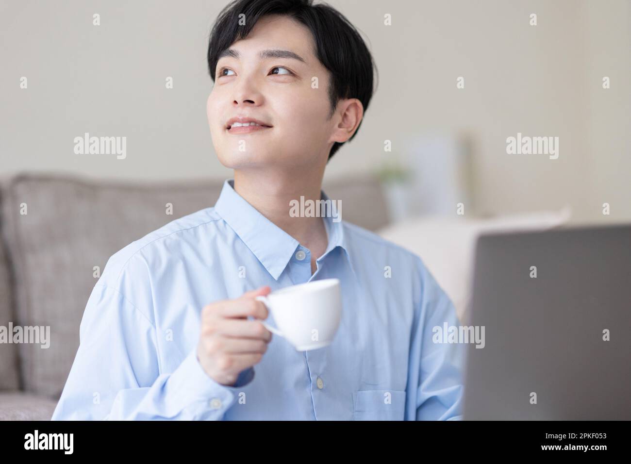 Man holding a cup Stock Photo