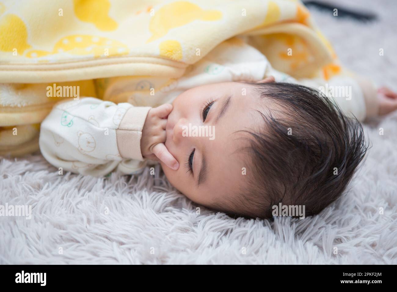 Baby Lying Down Stock Photo Alamy