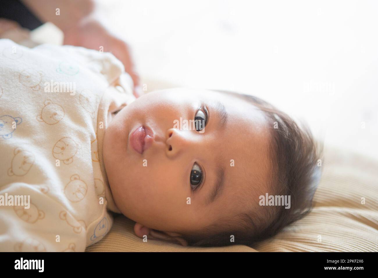 Baby Lying Down Stock Photo Alamy