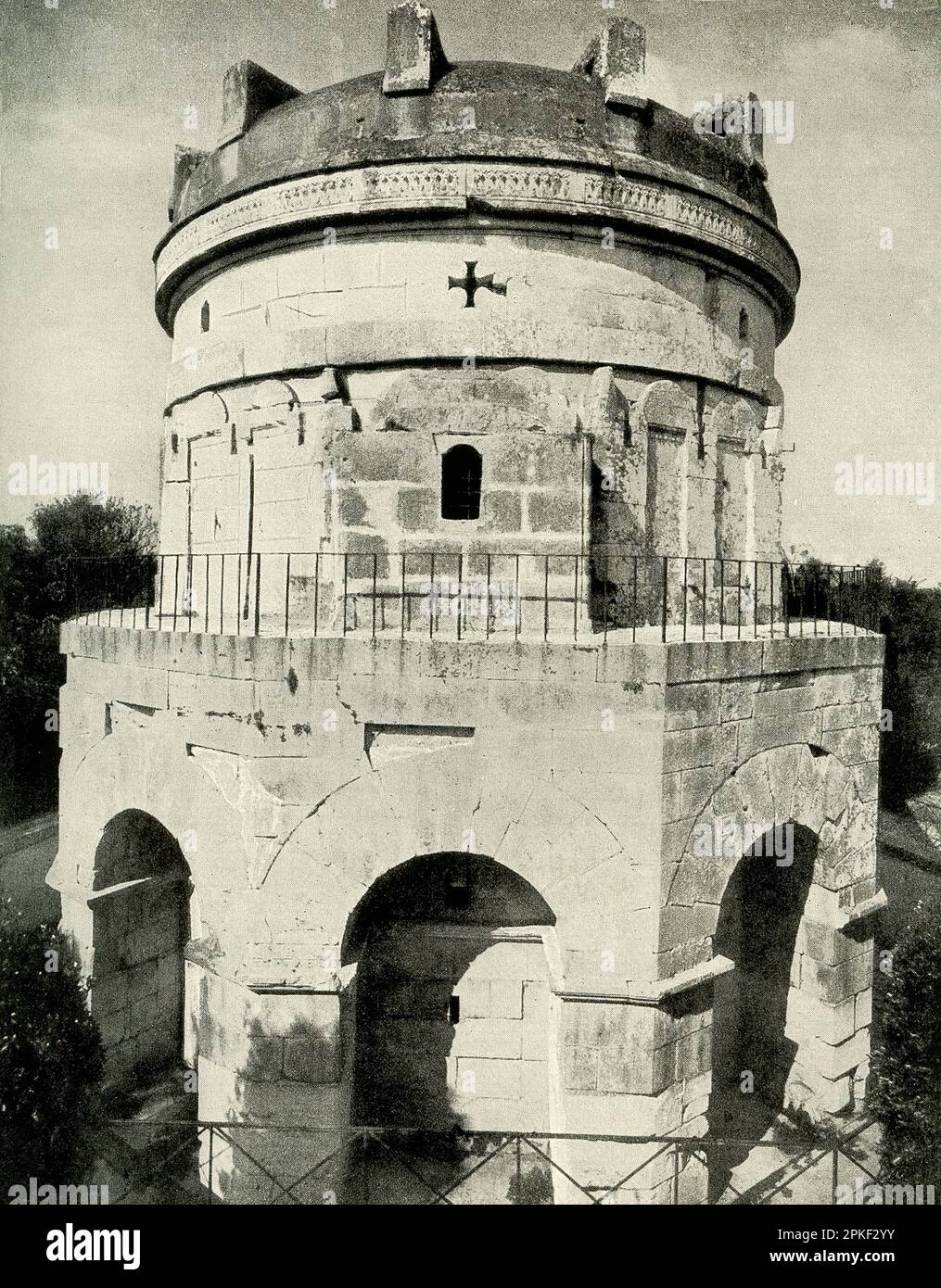This 1909 image shows the tomb of Theodorich of Ravenna. The Mausoleum of Theodoric is an ancient monument just outside Ravenna, Italy. It was built in 520 AD by Theodoric the Great, king of the Ostrogoths, as his future tomb. Theodoric, at the encouragement and direction of the Roman emperor Zeno, invaded Italy, deposed King Odoacer, and ruled over a kingdom of Romans and Goths from 493-526 AD Stock Photo