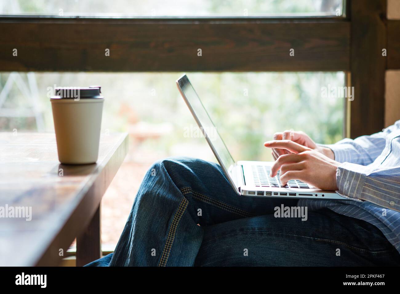 Men using computer in café Stock Photo