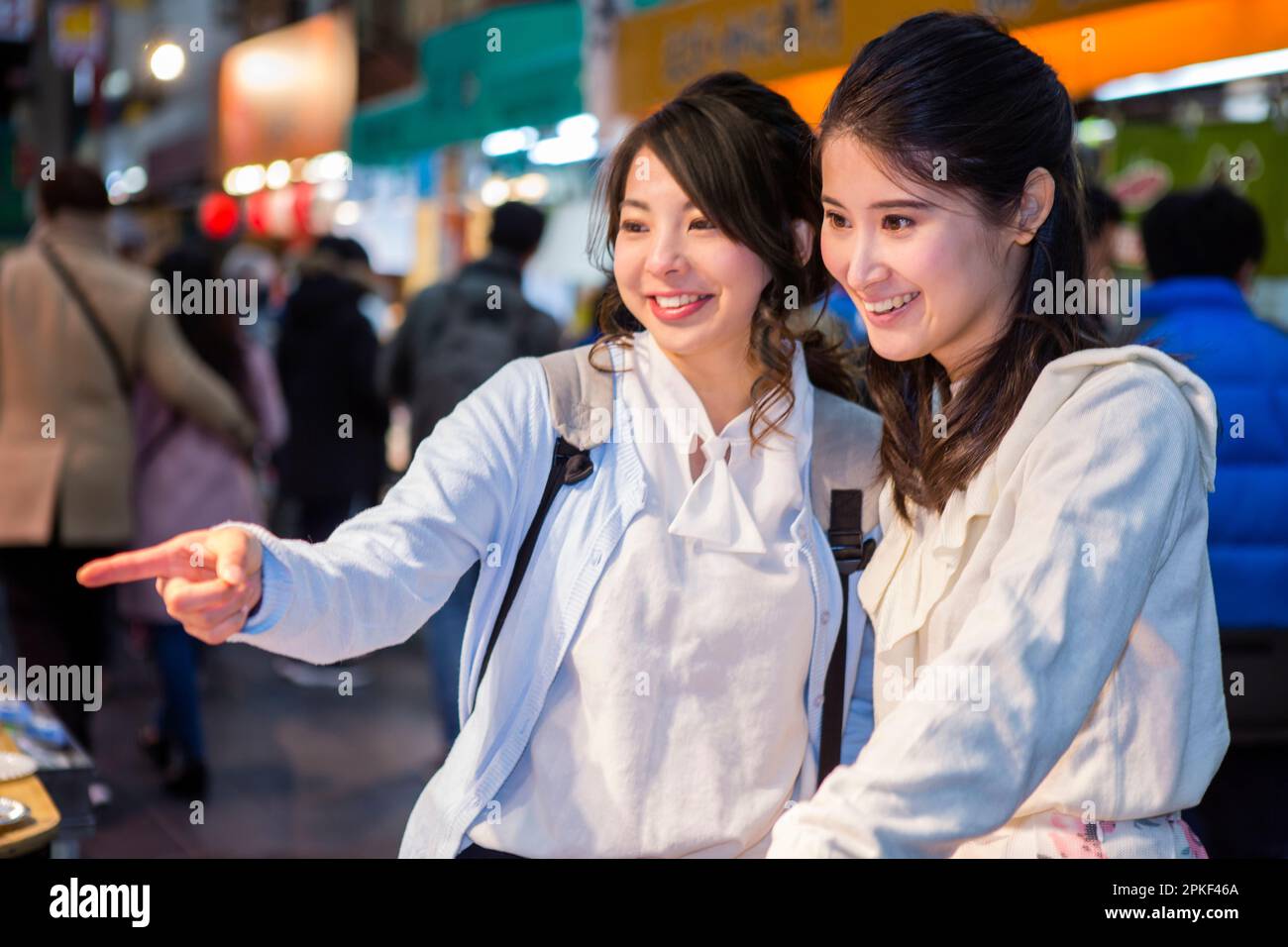 Two women touring Kuromon Market Stock Photo