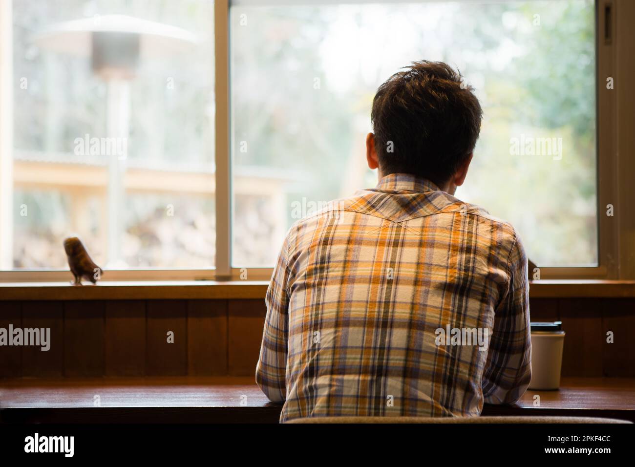 Men using smartphones at a café Stock Photo