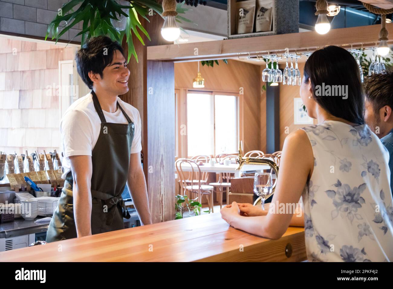 Cafe waitress and customer Stock Photo