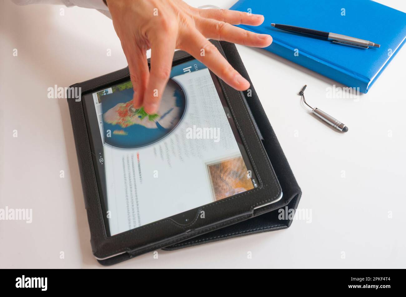 Man's hand using a tablet Stock Photo