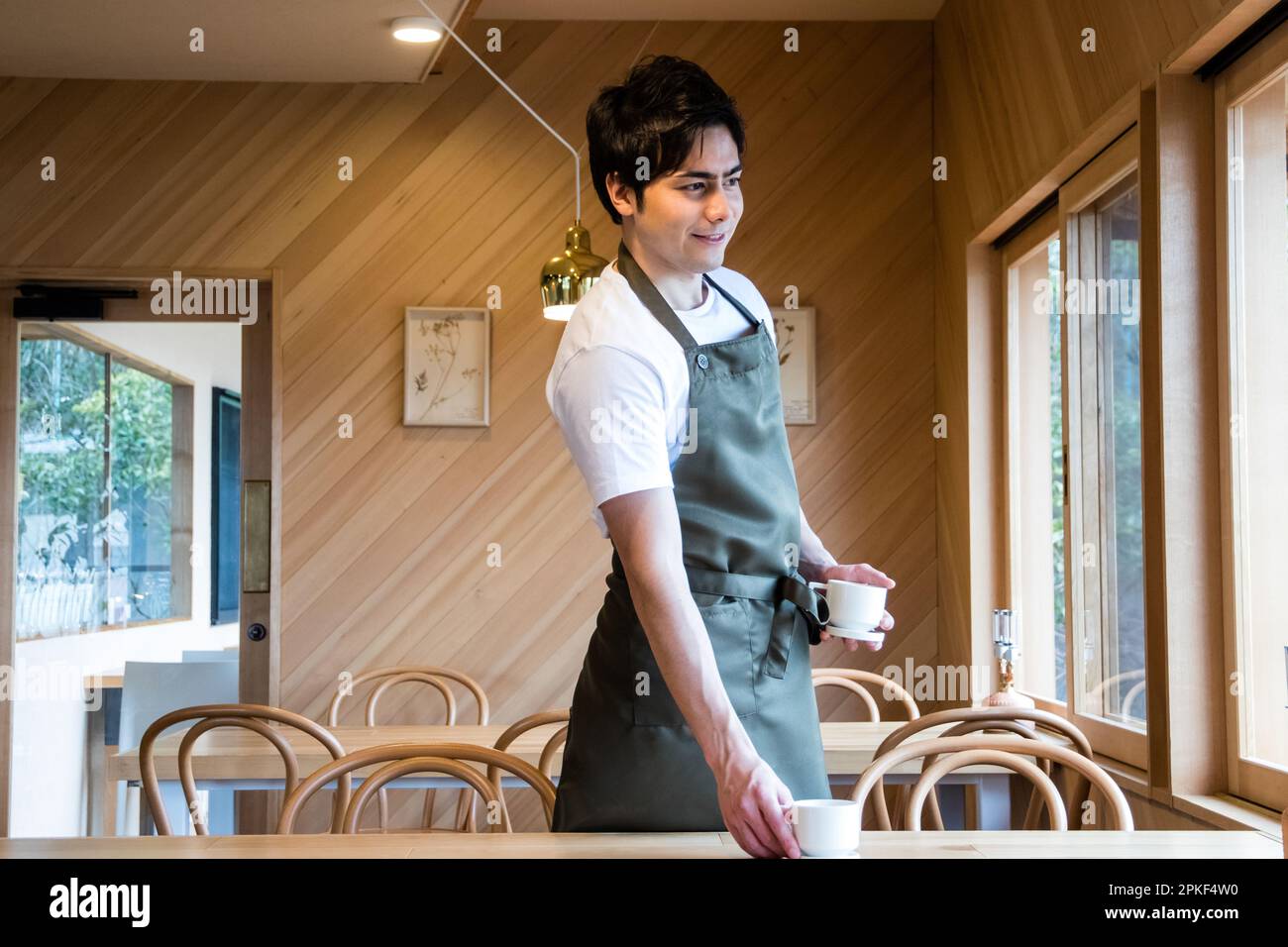 Cafe worker cleaning Stock Photo Alamy