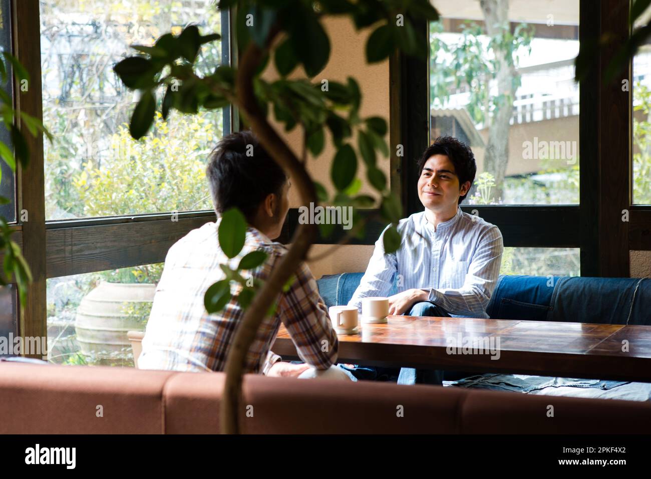 Men talking in a café Stock Photo