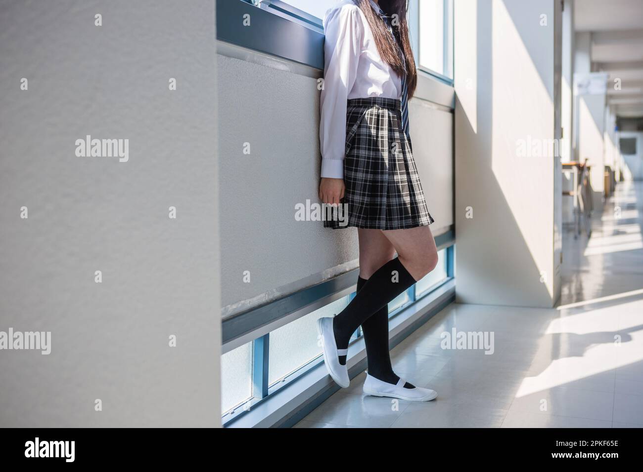 Junior high school girls standing in the hallway Stock Photo
