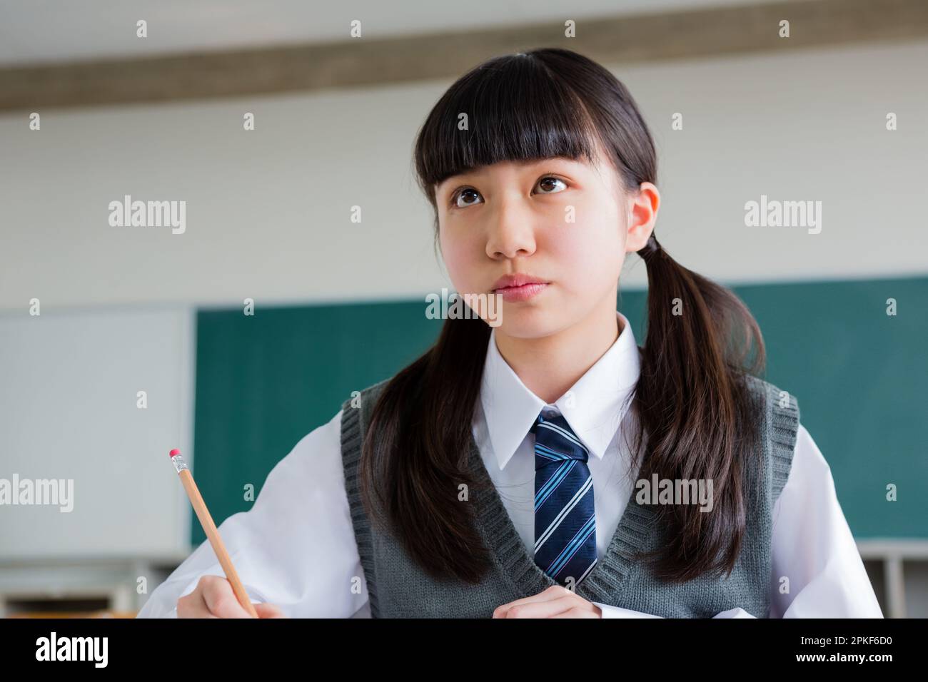 Junior high school girls studying in a classroom Stock Photo - Alamy