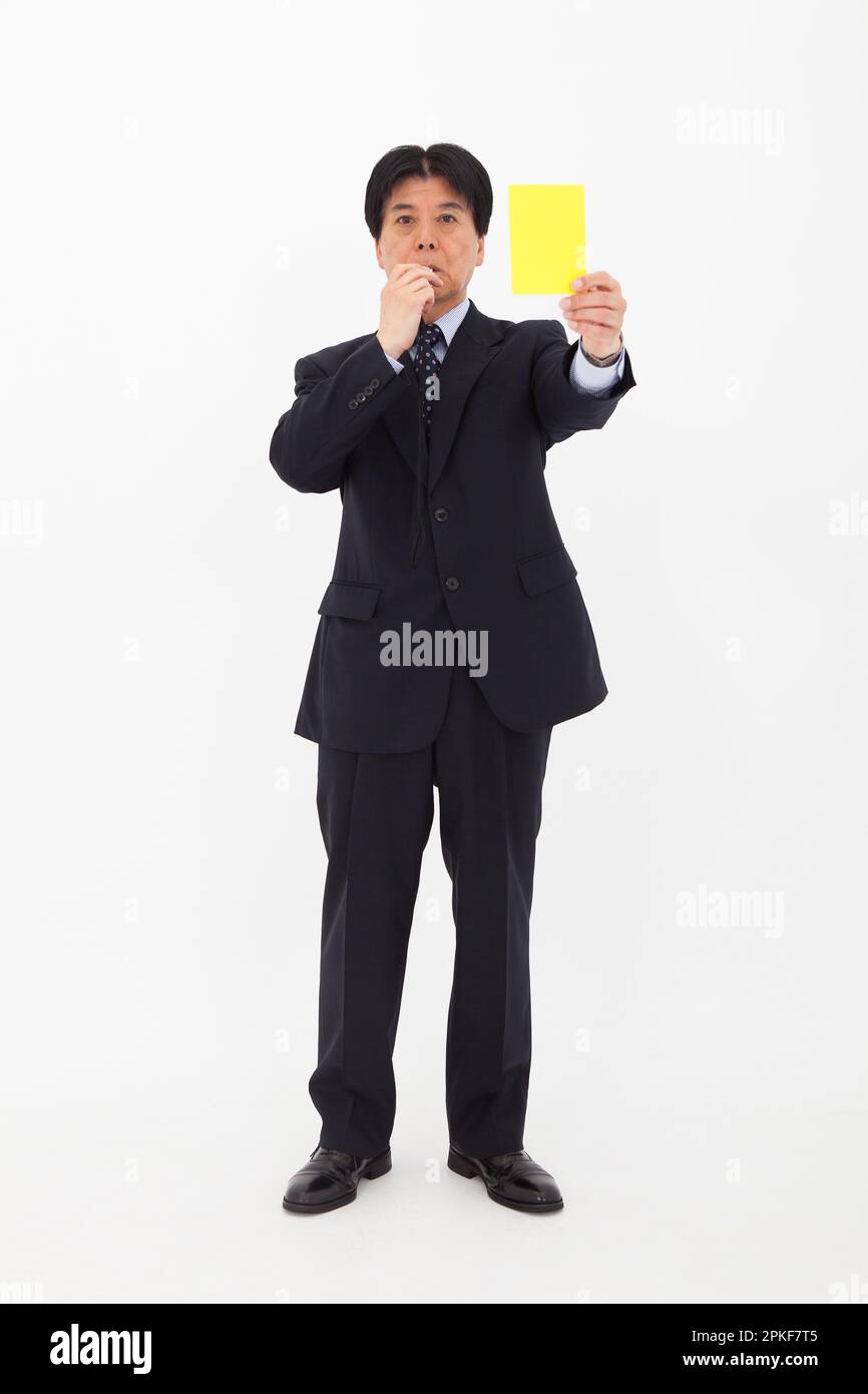Man showing yellow card Stock Photo Alamy
