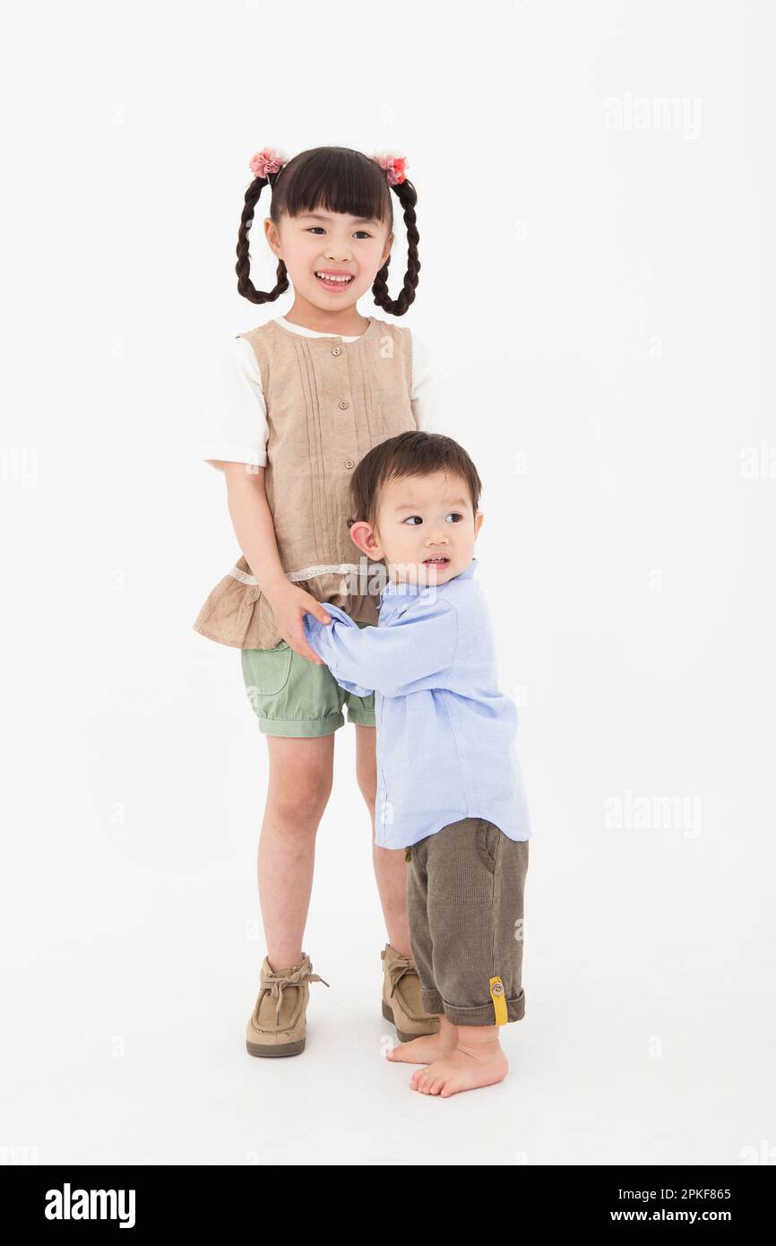 Boy and girl playing together Stock Photo