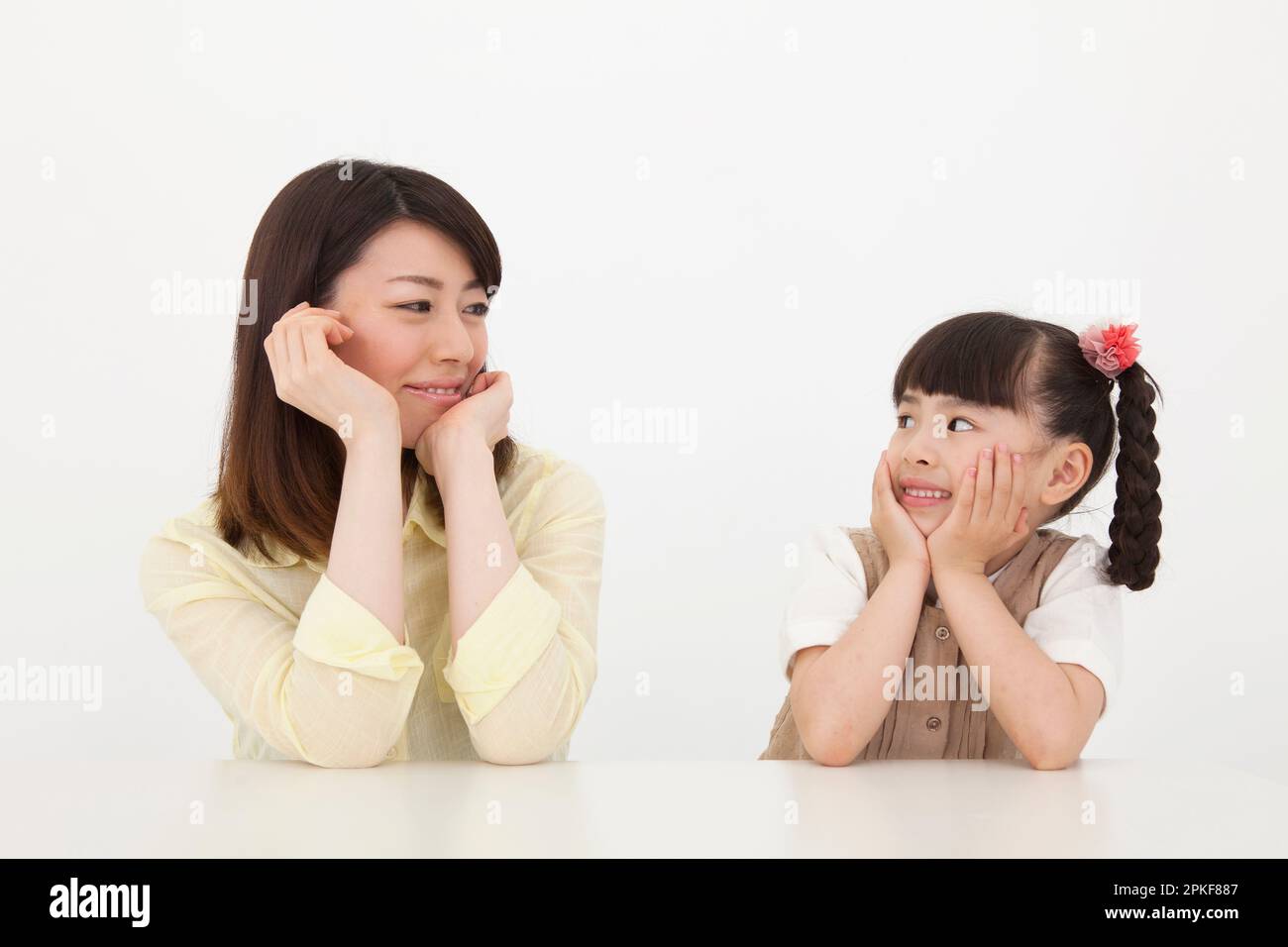 Smiling Woman And Girl Stock Photo