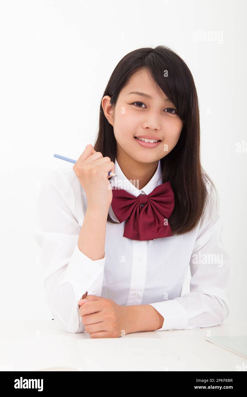 High school student holding a pencil Stock Photo - Alamy