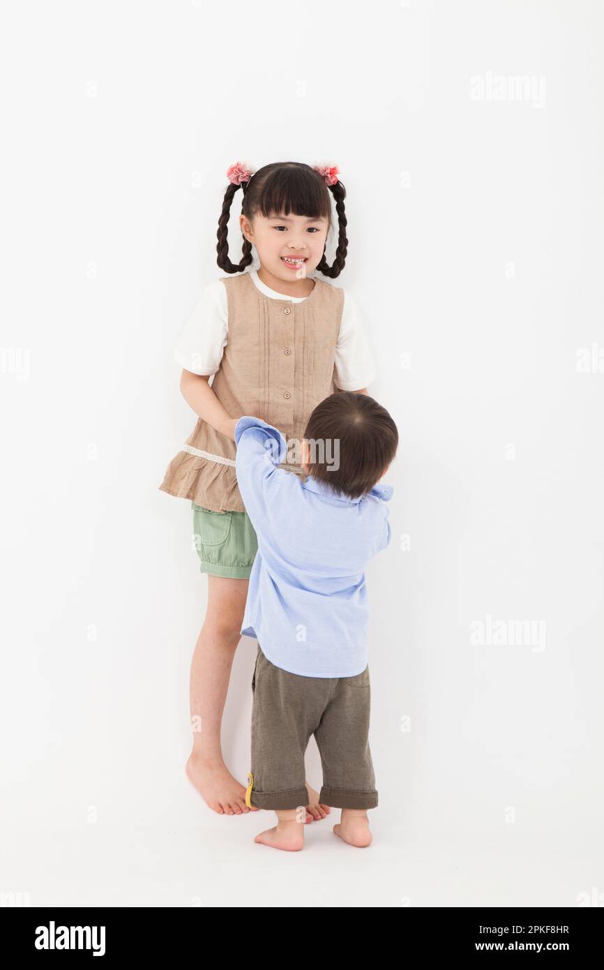 Boy and girl playing together Stock Photo