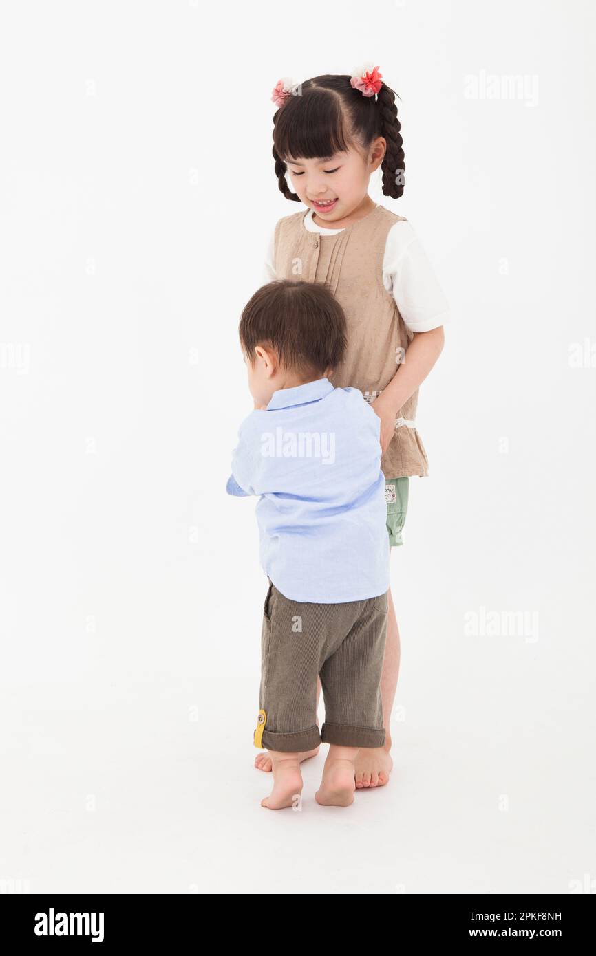 Boy and Girl playing together Stock Photo
