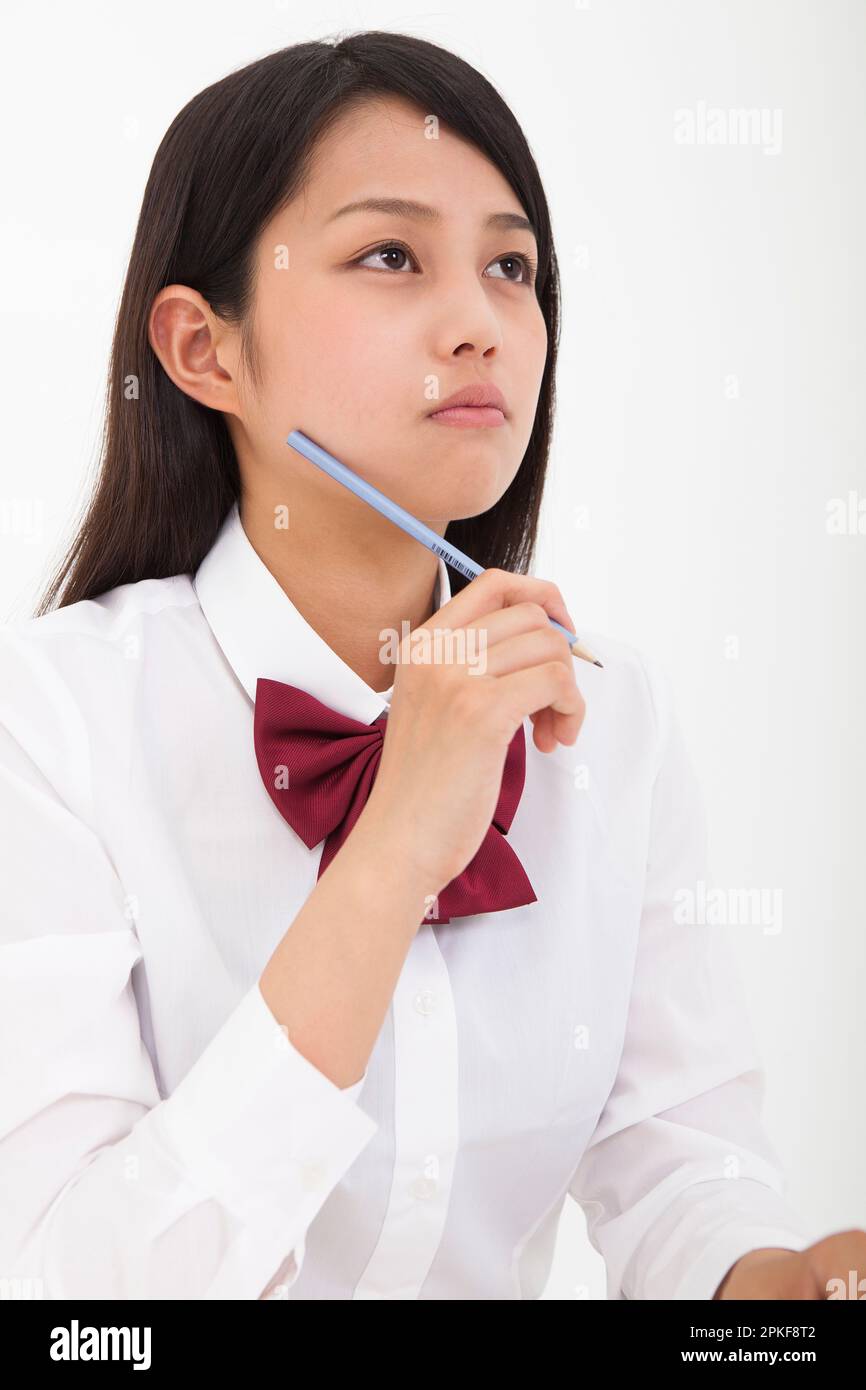 High school student holding a pencil Stock Photo Alamy