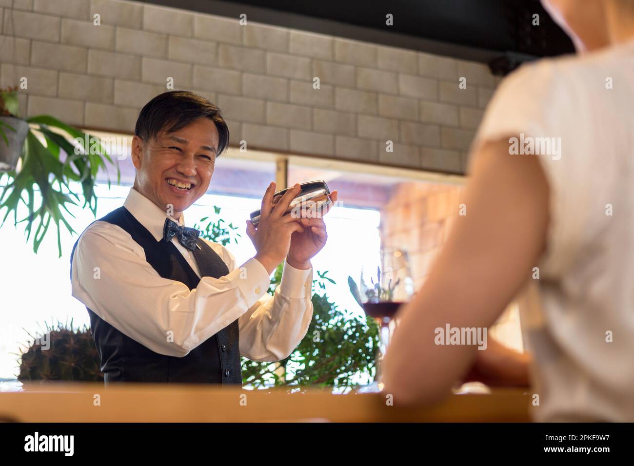 Bartender shaking a shaker Stock Photo Alamy