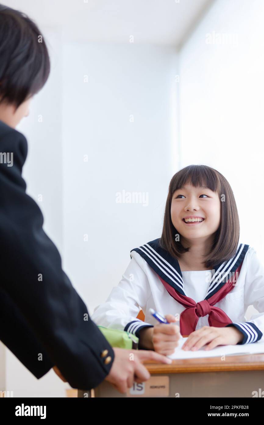 Junior high school students having a conversation stock photo alamy