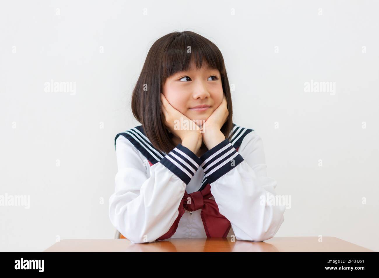 Junior High School Girl with Cheek Cane Stock Photo