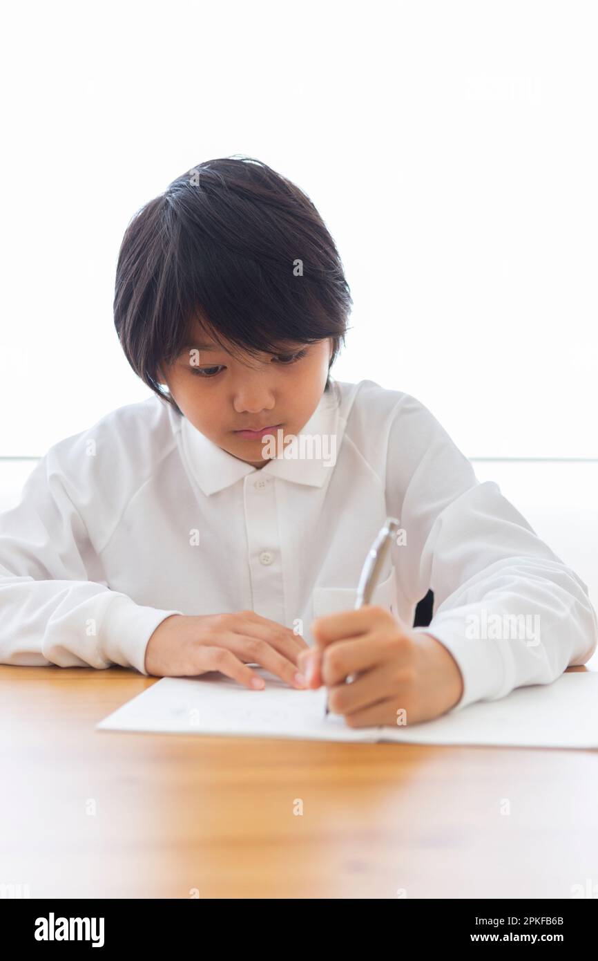 Junior high school students studying at home Stock Photo - Alamy