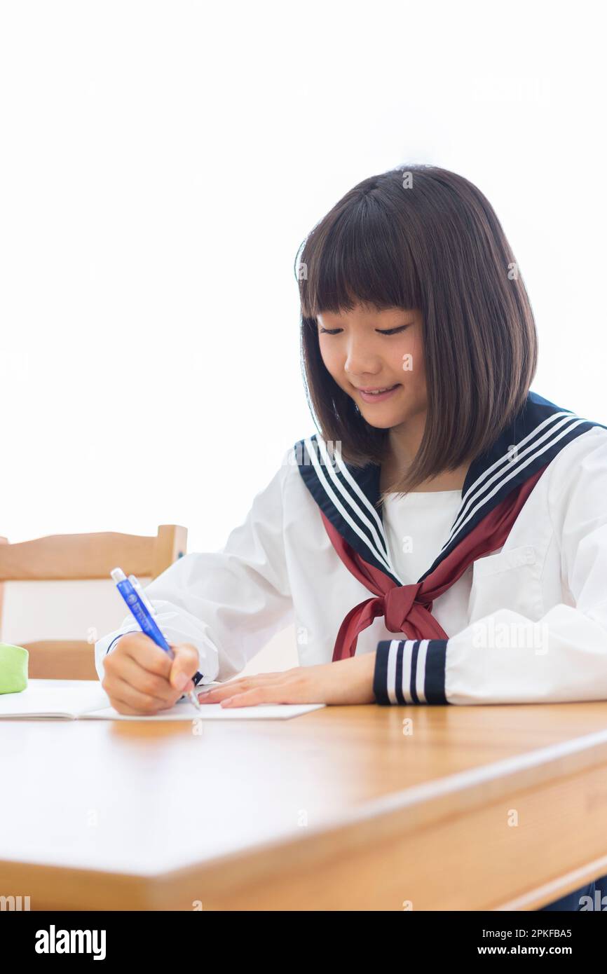 Junior high school students studying at home Stock Photo - Alamy