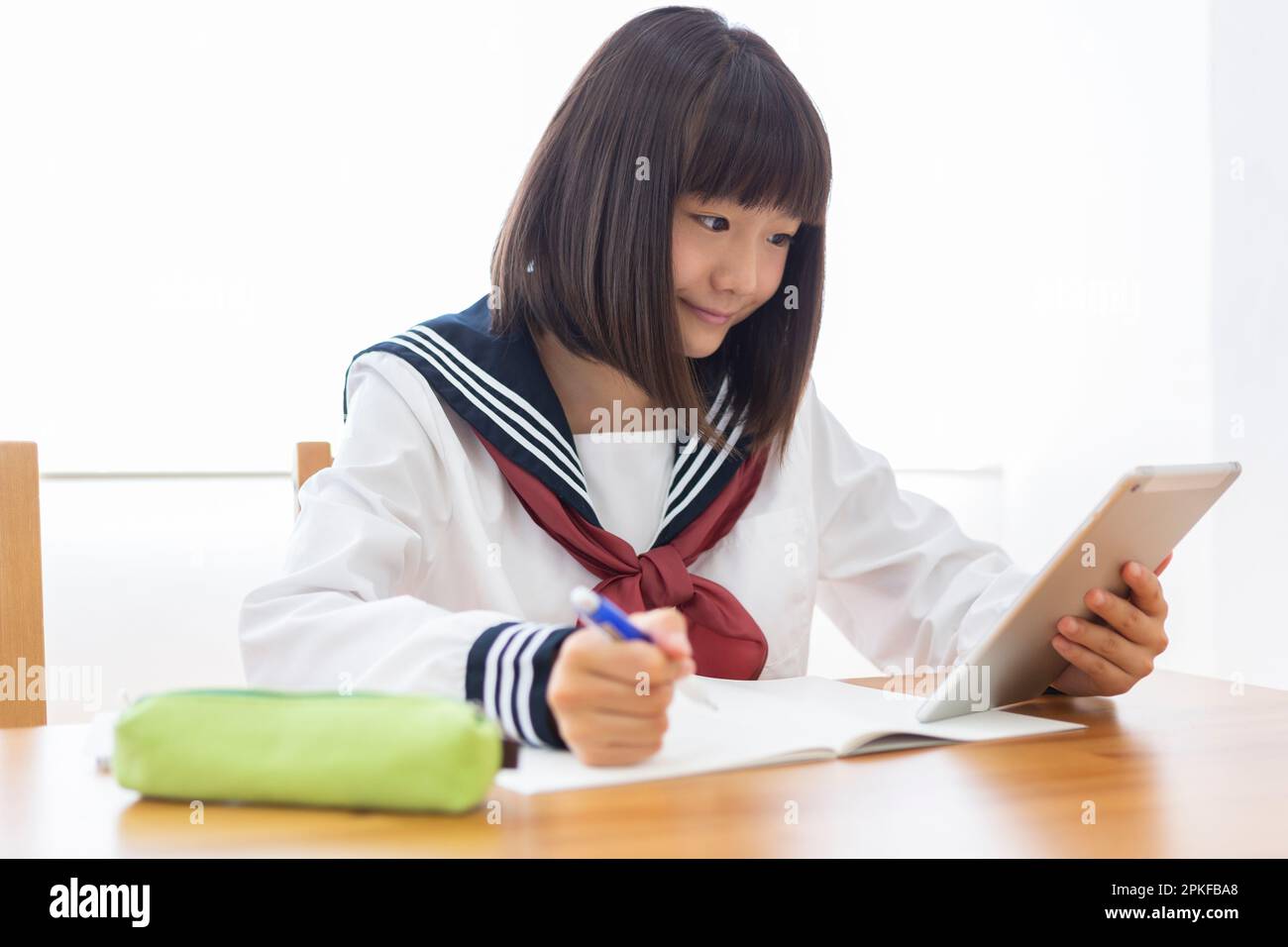 Junior high school students studying at home Stock Photo - Alamy