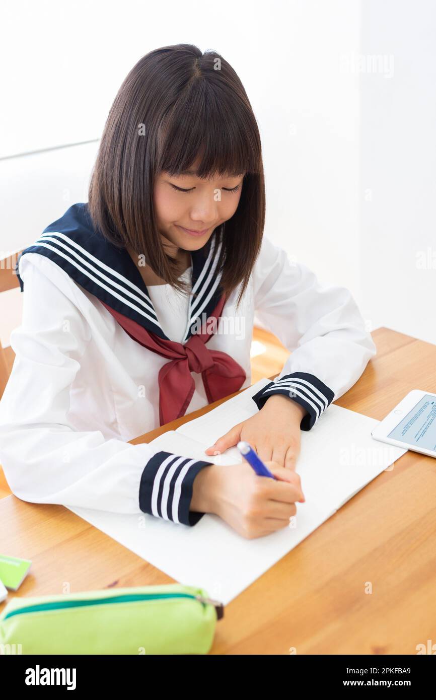Junior high school students studying at home Stock Photo - Alamy