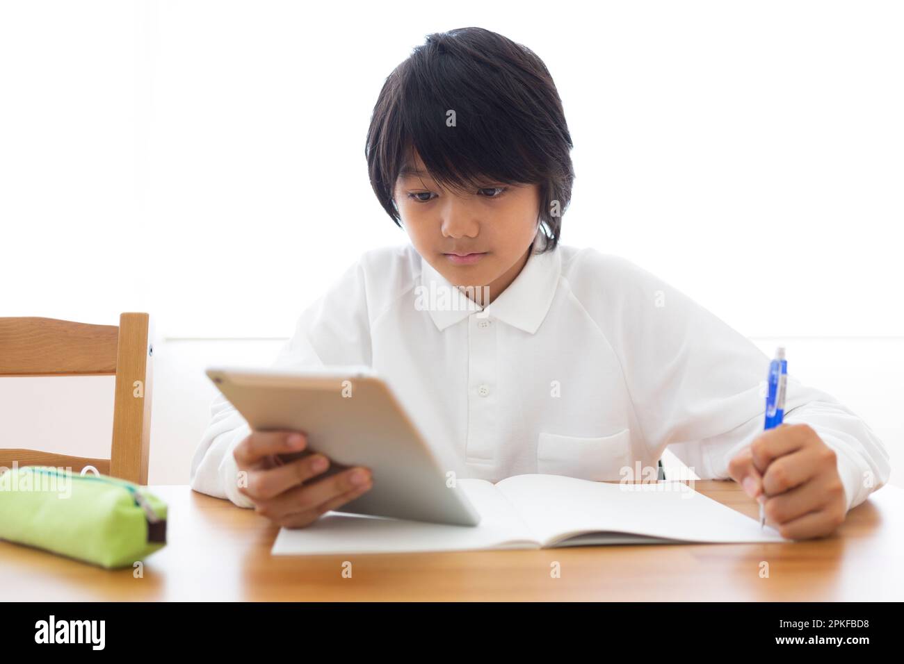 Junior high school students studying at home Stock Photo - Alamy