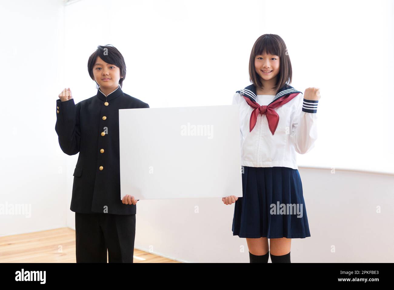 Junior high school students with boards Stock Photo