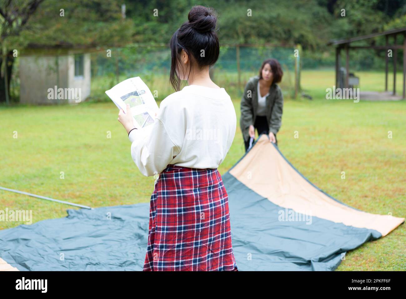 Woman Pitching Tent Stock Photo Alamy
