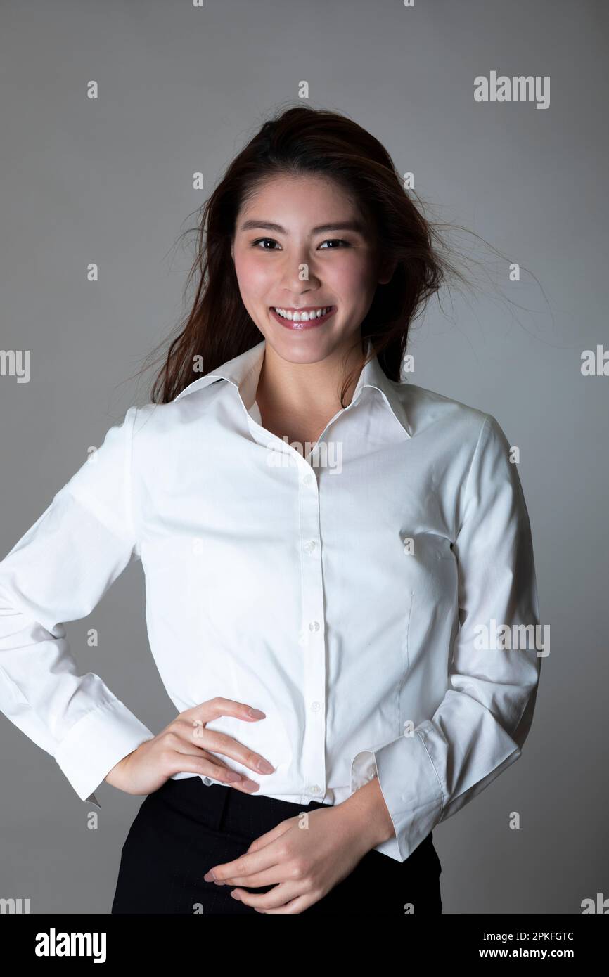 Portrait Of Woman In White Shirt Stock Photo - Alamy