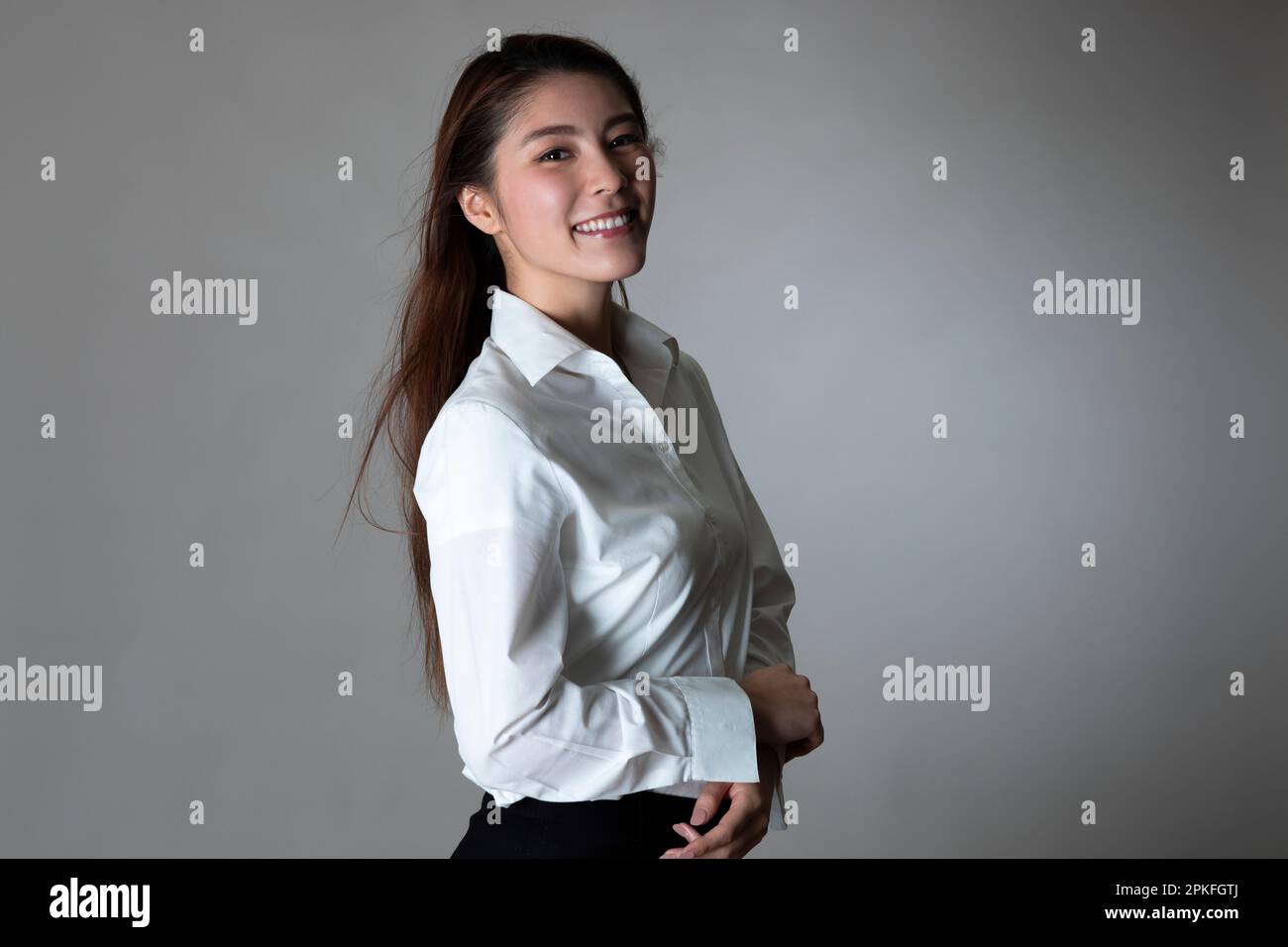 Portrait Of Woman In White Shirt Stock Photo - Alamy